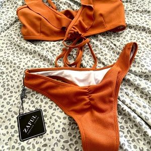Burnt orange bikini.